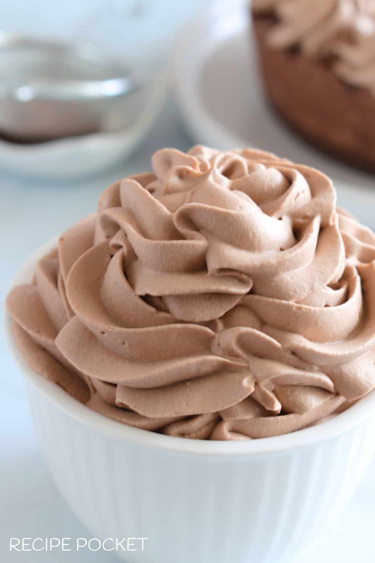 Chocolate whipped cream in a white pot.
