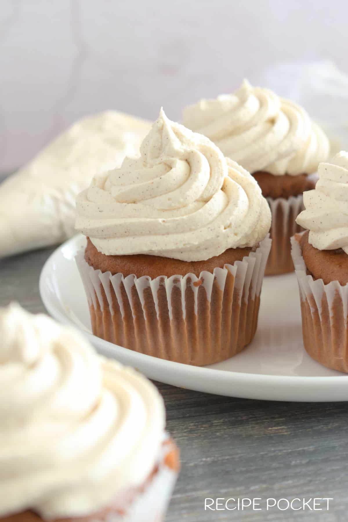 Chocolate cupcakes with cream on top.
