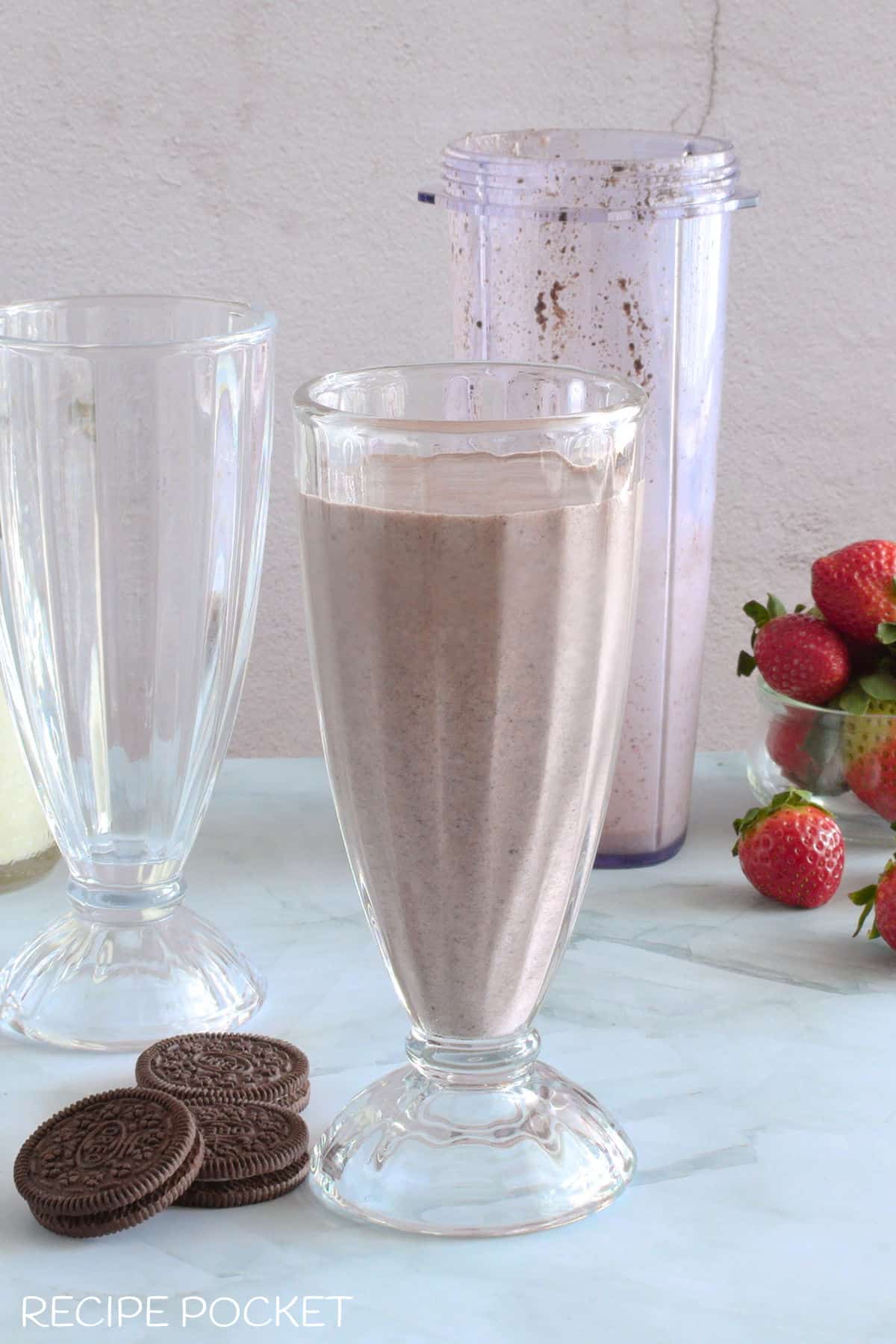 Blended milkshake poured into a glass.