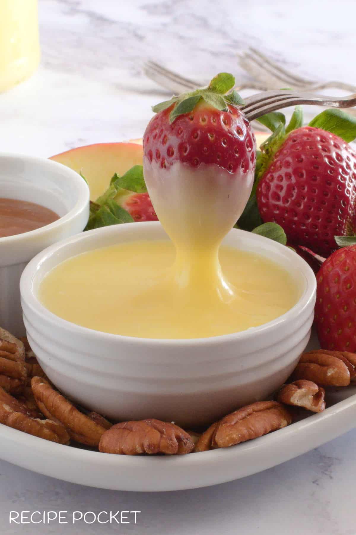 A strawberry dipped into chocolate sauce.