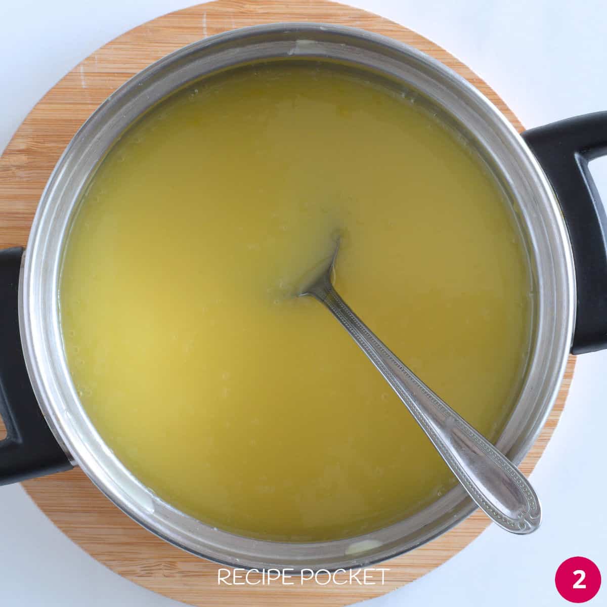Melted white chocolate, cream and butter in a saucepan.