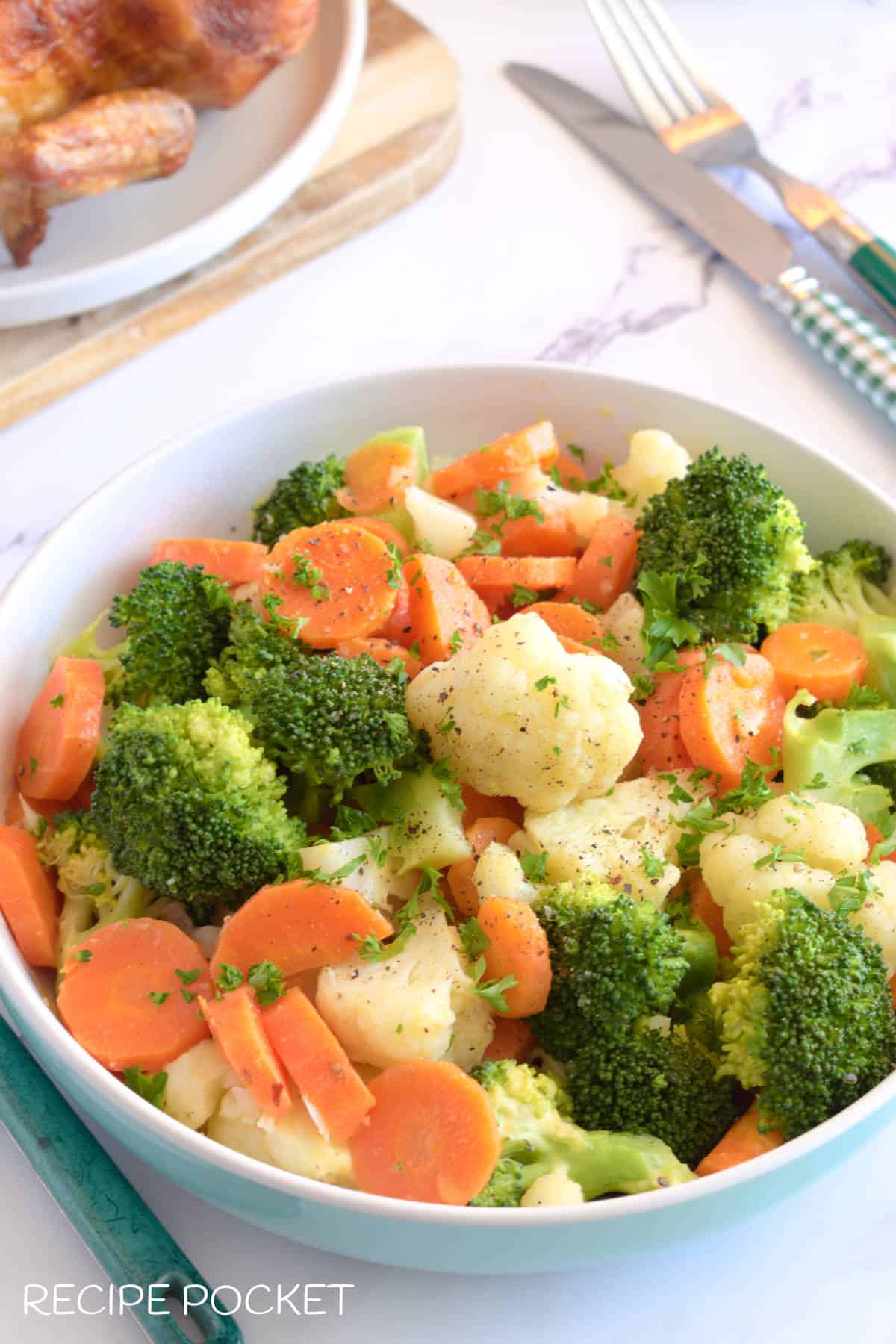 A bowl of steamed vegetables.