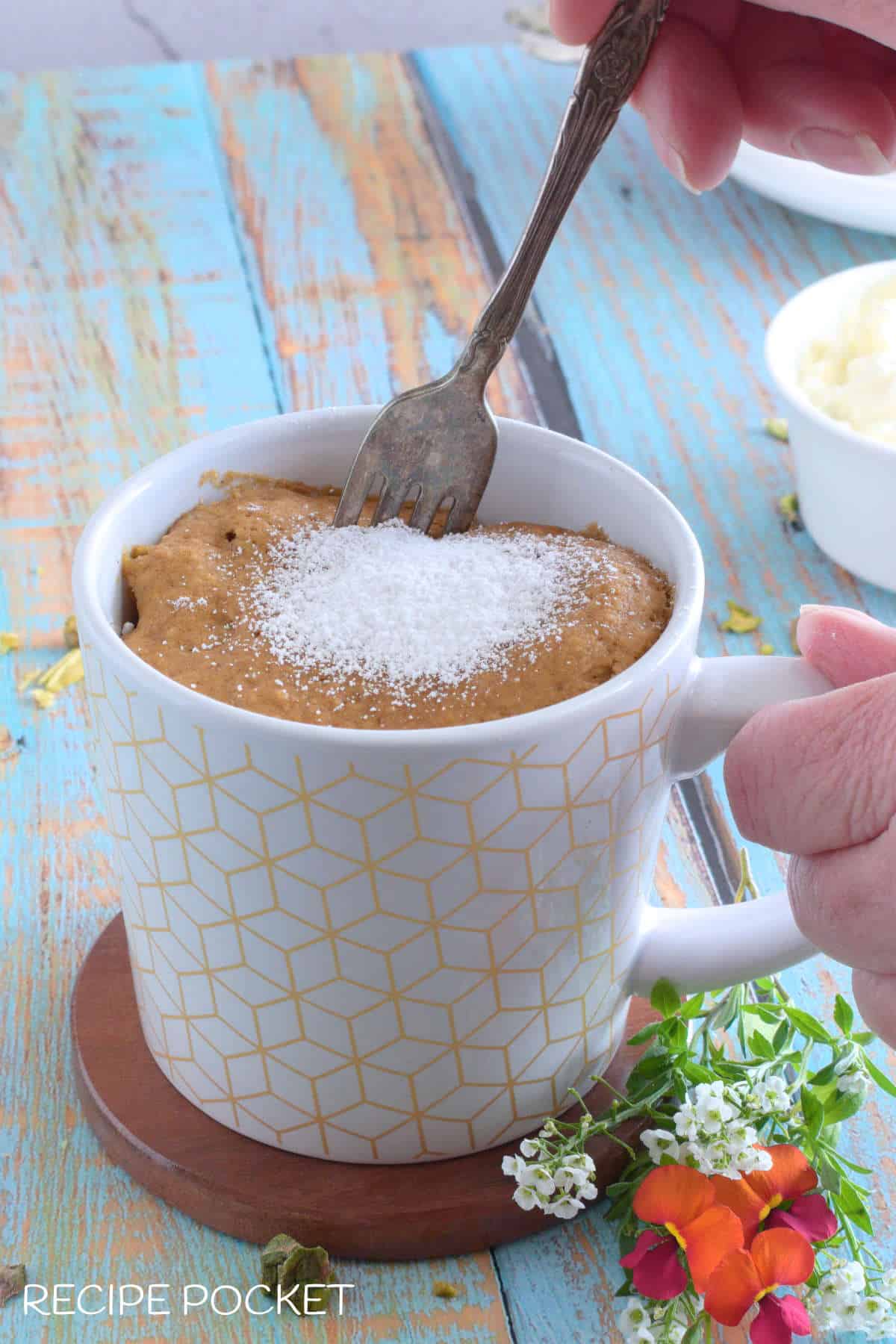 Mug cake with a fork.