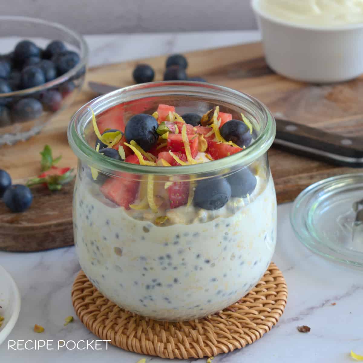 Overnight oats in a storage jar on a small bamboo mat.