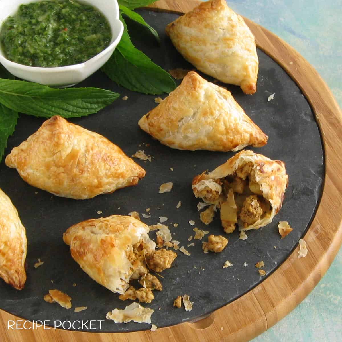 Homemade puff pastry chicken samosas.