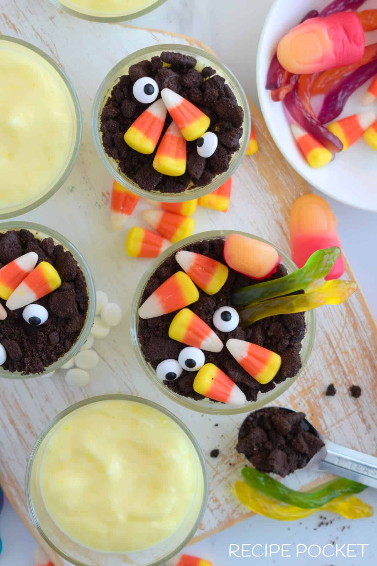 Top down photo of pudding cups being decorated.