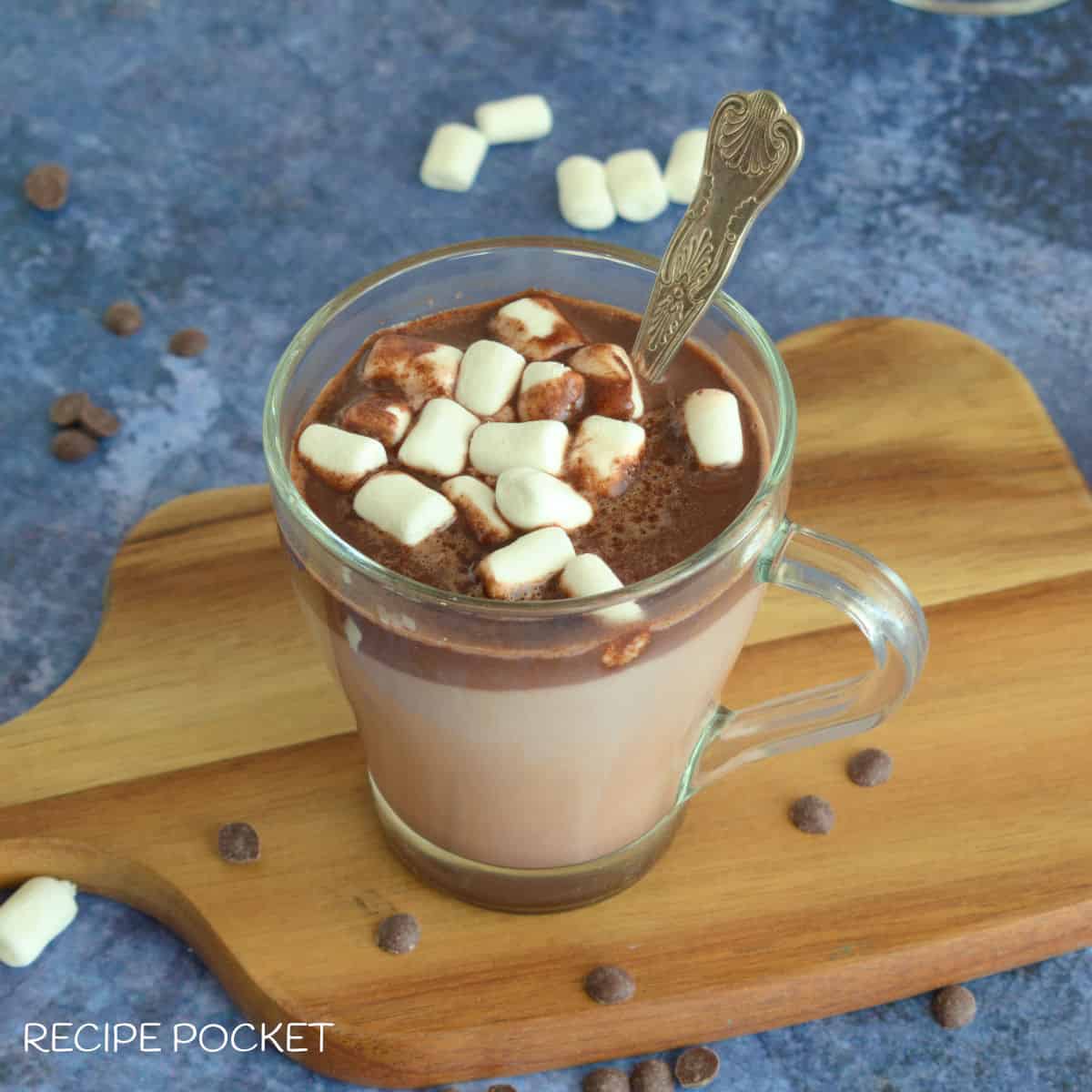 A top down view of a mug of hot chocolate with marshmallows on top.