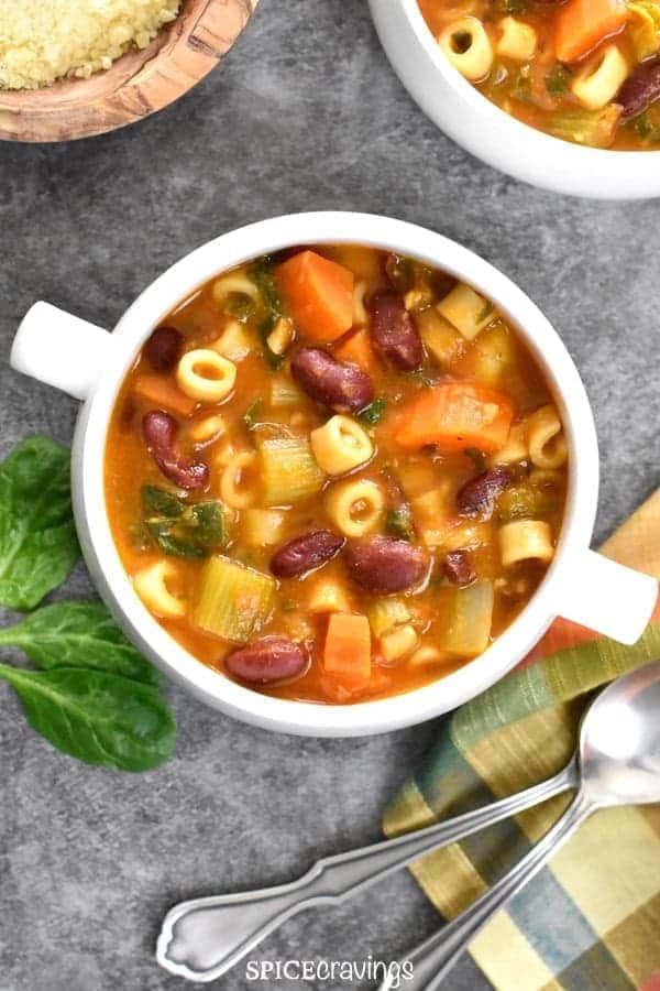 A bowl of pasta and beans soup.