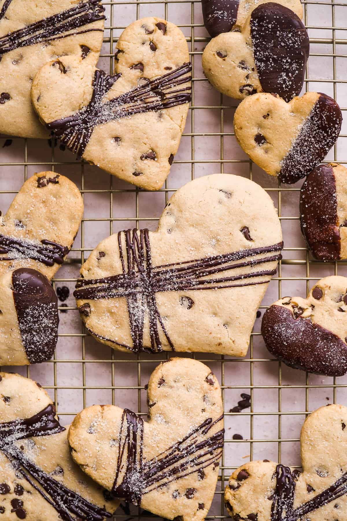 Heart shaped cookies with chocolate drizzle.