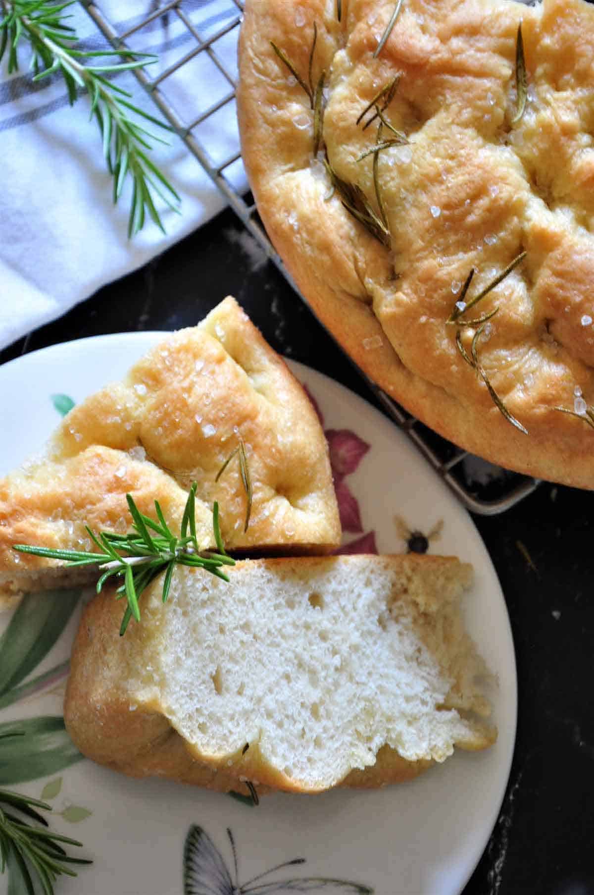 A closeup of wedged or bread on a white plate.
