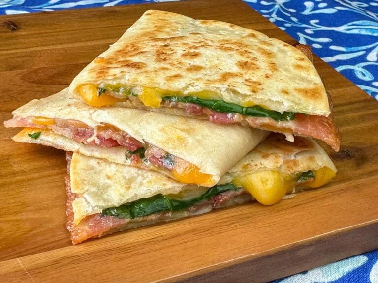 Egg and bacon quesadilla with spinach.